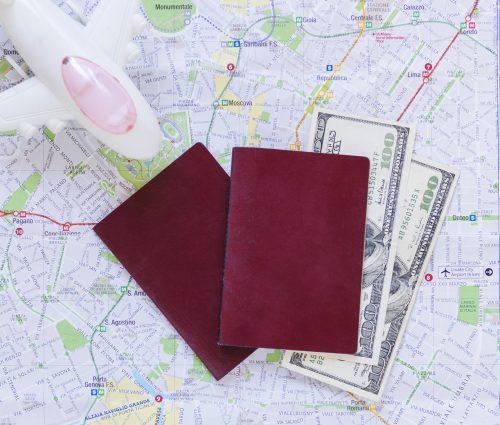 elevated-view-airplane-passport-banknotes-map